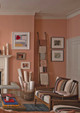 Tonal peach lounge with cushions in Bolton Ecru, Vertical Khaki, Voyage Pale Blue, and Unravel Terracotta. Design by Alice Leigh Design. Photography by Tom St Aubin.
